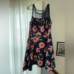 Navy blue cocktail dress with illusion neckline.